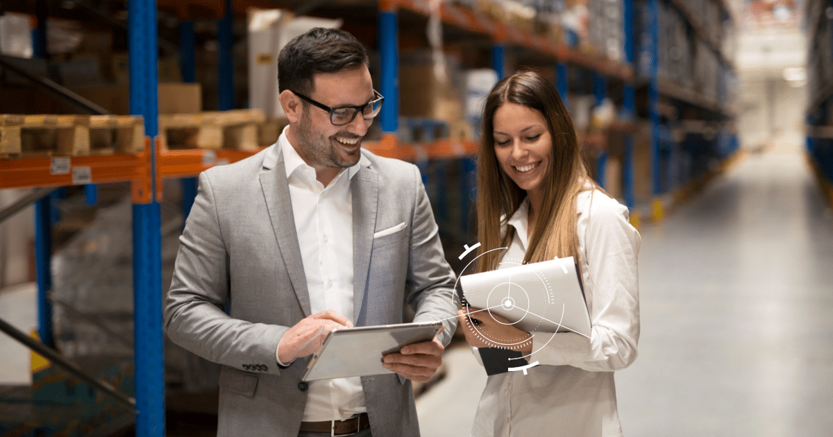 Auditors walking inside a factory for flash audit, holding check sheets and a tablet.
